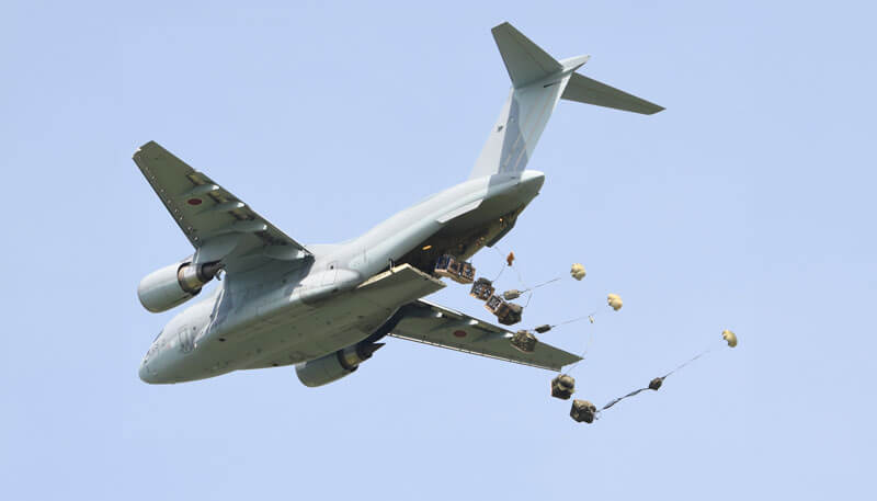 Humanitarian aid being air dropped via air cargo charter by Dela World Charter.